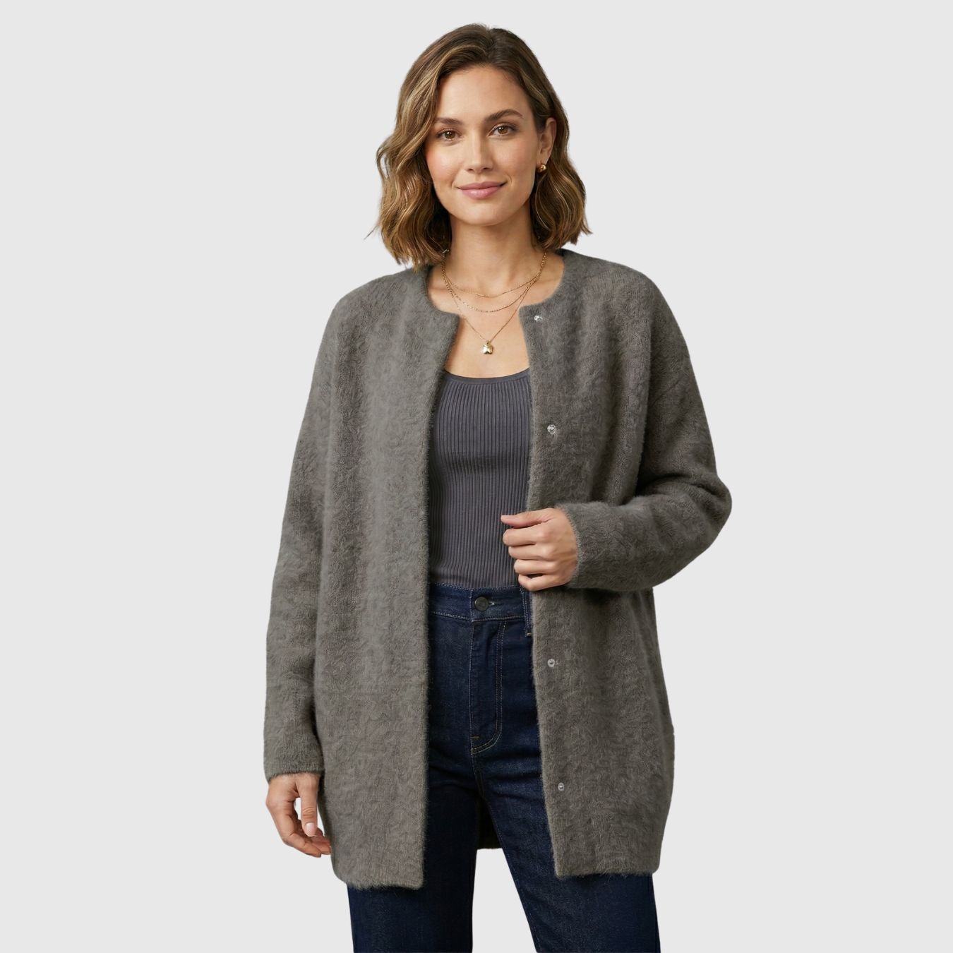 Gilet femme laine coupe ample avec poches et empiècements suédés